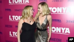 Tonya Harding, left, and Margot Robbie arrive at the Los Angeles premiere of "I, Tonya" at the Egyptian Theatre on Tuesday, Dec. 5, 2017. (Photo by Jordan Strauss/Invision/AP)