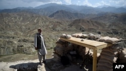 FILE - A member of the local police patrols a checkpoint for Islamic State militants in Nangarhar province, Afghanistan, July 7, 2018. U.S. Secretary of State Marco Rubio said on Feb. 20, 2025, that Islamic State and other terrorists could be operating in Afghanistan.