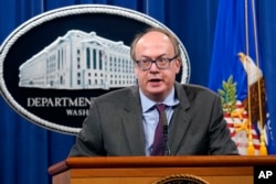 FILE - Jeffrey Clark, then-Assistant Attorney General, speaks during a news conference at the Justice Department in Washington, Sept. 14, 2020.