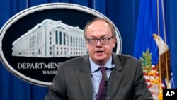 FILE - Jeffrey Clark, then an assistant attorney general, speaks during a news conference at the Justice Department in Washington, Sept. 14, 2020.