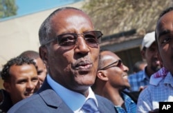 FILE - Muse Bihi Abdi speaks to the media after casting his vote in the presidential election in Hargeisa, in the semi-autonomous region of Somaliland, in Somalia, Nov. 13, 2017.