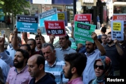 Demonstrators shout slogans during a protest against a Syrian military operation in the rebel-held Idlib province of northwest Syria, in Diyarbakir, Turkey. Sept. 7, 2018.