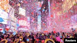 Confetti flies around the ball and countdown clock during the first public New Year's event at Times Square, in the Manhattan borough of New York City, Jan. 1, 2023. 