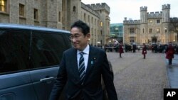 Japan's Prime Minister Fumio Kishida leaves after signing a defense agreement with Britain's Prime Minister Rishi Sunak, in London, Jan. 11, 2023. 