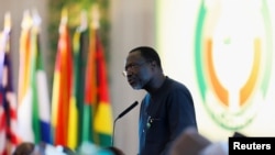 FILE - The president of West African regional bloc ECOWAS Omar Alieu Touray addresses the commission during the 62nd Ordinary Session of Authority of Heads of State and Government of ECOWAS, in Abuja, Nigeria, Dec. 4, 2022.