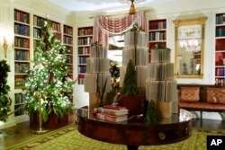 The Library of the White House is decorated for the holiday season during a press preview of holiday decorations at the White House, Nov. 28, 2022, in Washington.