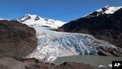 In this file photo, pieces of ice float on Mendenhall Lake in front of the Mendenhall Glacier on Monday, May 30, 2022, in Juneau, Alaska. (AP Photo/Becky Bohrer)