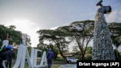 A giant art sculpture showing a tap outpouring plastic bottles at the UN Environment Assembly (UNEA) where delegates met to address the growing problem of plastic waste.