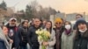 Iranian prominent actress Taraneh Alidoosti, center, holds bunches of flowers as she poses for a photo among her friends after being released from Evin prison in Tehran, Jan. 4, 2023. (Gisoo Faghfouri, Sharghdaily, via AP)