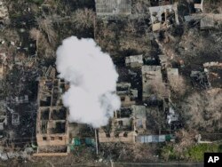 Smoke billows after Russian attacks in the outskirts of Bakhmut, Ukraine, Dec. 27, 2022