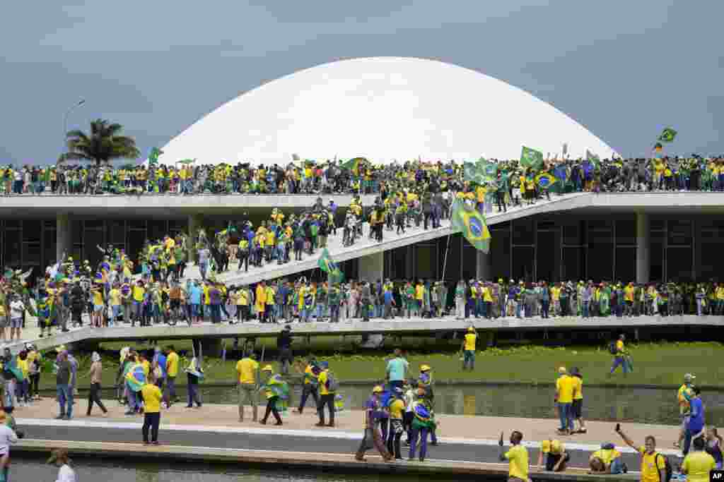 Supporters of Brazil&#39;s former President Jair Bolsonaro storm the the National Congress building in Brasilia, Brazil, Jan. 8, 2023.&nbsp;