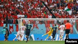 Australia's Mitchell Duke scores against Tunisia in a Group D match at the 2022 FIFA World Cup, Qatar, November 26, 2022