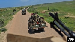 FILE - Somali soldiers patrol in convoy near Sanguuni military base about 450 km south of Mogadishu, Somalia, June 13, 2018. 