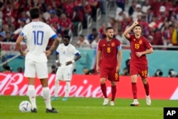 Carlos Soler, right, celebrates Spain's sixth goal during the World Cup group E soccer match between Spain and Costa Rica, at the Al Thumama Stadium in Doha, Qatar, Nov. 23, 2022. Spain won 7-0.