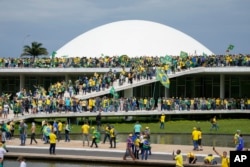 FILE - Supporters of former Brazilian President Jair Bolsonaro storm the National Congress building in Brasilia, Brazil, Jan. 8, 2023.