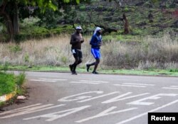 People exercise inside Warren Hills cemetery in Harare, Zimbabwe, November 24 ,2022.REUTERS/Philimon Bulawayo