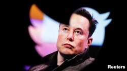 FILE - Elon Musk's photo is seen through a Twitter logo in this illustration created Oct. 28, 2022. As of Dec. 21, 2022, Musk was seeking a new leader to run the social media network.