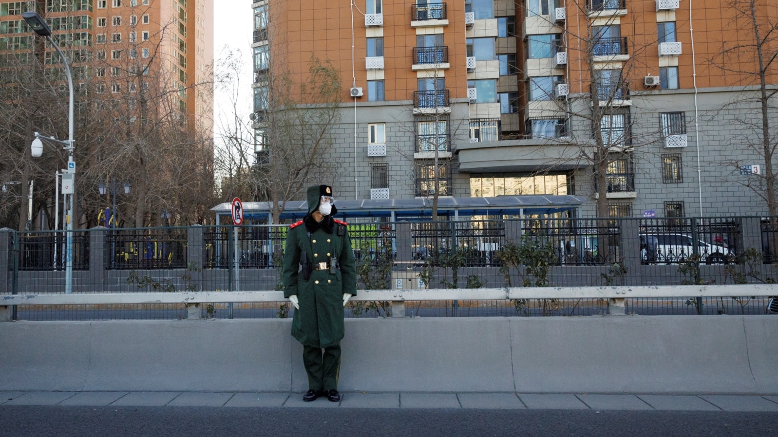 A member of the Chinese People's Armed Police Force wears a face mask as he keeps watch on a street amid coronavirus disease (COVID-19) outbreaks in Beijing, Dec. 1, 2022. 