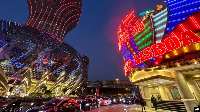 Casino Lisboa, right, is seen in Macao on Dec. 28, 2022. (AP Photo/Kanis Leung)