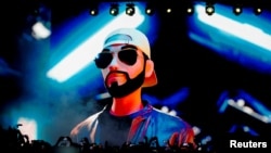 FILE PHOTO: An animation showing El Salvador's President Nayib Bukele is displayed on a large screen at the closing party of the "Bitcoin Week" where he announced the plan to build the first "Bitcoin City" in the world, in Teotepeque, El Salvador Nov. 20, 2022.