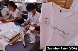 T-shirts of Sombath Somphone are displayed at an event in Bangkok, Thailand, Dec. 15, 2022, marking the 10-year anniversary of his enforced disappearance in Laos.
