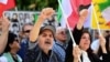 People react to the verdict of the trial of Hamid Nouri, a former Iranian official accused of crimes against international law and murder in Iran in 1988, outside the Stockholm District Court on July 14, 2022. (Chris Anderson/TT News Agency/via Reuters)
