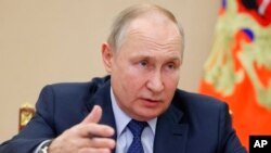 Rais wa Russa Vladimir Putin akiwa kwenye kikao cha baraza la kitaifa la haki za binadamu mjini Moscow, Dec. 7, 2022. 