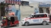 A Samocare ambulance carrying an unidentified wounded person drives into the Kalkaal hospital after al Qaeda-linked al Shabaab Islamist militants attacked Villa Rays hotel, in Mogadishu, Somalia Nov. 28, 2022.