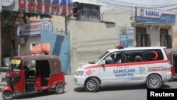 A Samocare ambulance carrying an unidentified wounded person drives into the Kalkaal hospital after al Qaeda-linked al Shabaab Islamist militants attacked Villa Rays hotel, in Mogadishu, Somalia Nov. 28, 2022.