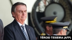 Presiden Brazil Jair Bolsonaro menghadiri upacara wisuda kadet Akademi Militer di Resende, negara bagian Rio de Janeiro, Brazil, Sabtu, 26 November 2022. (Foto: TÉRCIO TEIXEIRA / AFP)
