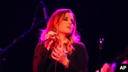 FILE - Lisa Marie Presley performs on June 20, 2012, in Chicago. Presley, the only child of Elvis Presley, died Jan. 12 after being hospitalized earlier in the day, her mother said.