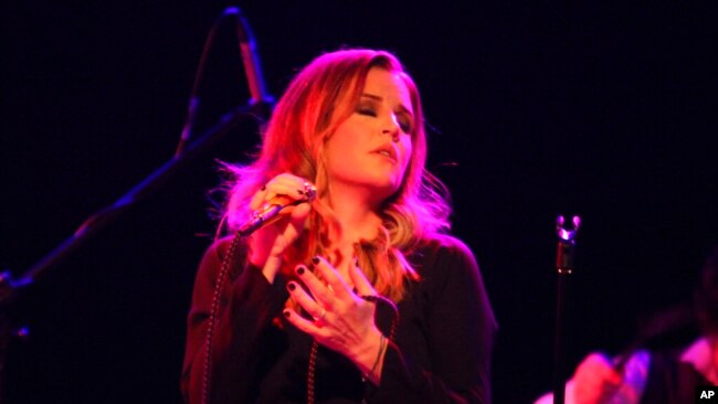 FILE - Lisa Marie Presley performs on June 20, 2012, in Chicago. Presley, the only child of Elvis Presley, died Jan. 12 after being hospitalized earlier in the day, her mother said.
