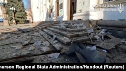 View of the damage at Svobody Square after the landmark Kherson Regional State Administration building was reportedly hit by rocket fire by Russia amid their ongoing invasion in Kherson, Ukraine in this still image from video released, Dec. 14, 2022.