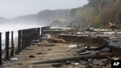 A parking lot at Seacliff State Beach is damaged by heavy storm surge Jan. 5, 2023, in Aptos, Calif.