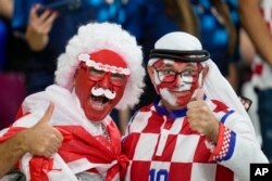 Croatia and Canada fans cheer ahead of the World Cup group F soccer match between Croatia and Canada, at the Khalifa International Stadium in Doha, Qatar, Nov. 27, 2022.