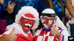 FILE: Croatia fan (right) "thumbs up" ahead of the World Cup group F soccer match between Croatia and Canada, at the Khalifa International Stadium in Doha, Qatar, Nov. 27, 2022.