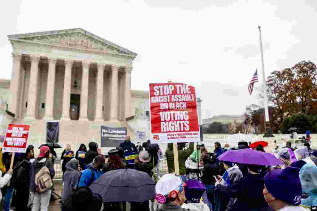 A rally is held in front of the Supreme Court in Washington as the Court hears arguments on a new elections case that could dramatically alter voting in 2024 and beyond.