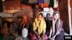 An unidentified Rohingya family is seen at their Cox's Bazar shanty in Bangladesh. The family, like many others in the community, has been unable to afford to marry off their oldest daughters, aged 20 and 18. (Noor Hossain/VOA)