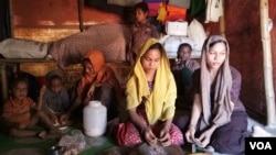 An unidentified Rohingya family is seen at their Cox's Bazar shanty in Bangladesh. Refugees in Bangladesh have for years sought to go to work and live in Malaysia. (Noor Hossain/VOA)