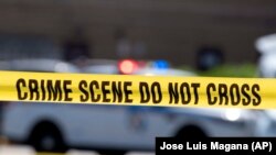 Ilustracija: Žuta policijska traka na mjestu zločina nakon pucnjave u Baltimoru u julu 2021. godine. (AP/Jose Luis Magana)