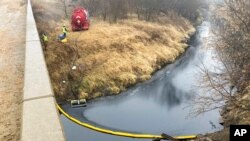 A remediation company deploys a boom on the surface of an oil spill after a Keystone pipeline ruptured at Mill Creek in Washington County, Kansas, Dec. 8, 2022.