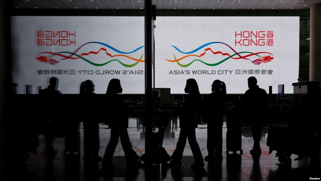 FILE - Travelers at Hong Kong International Airport after the lifting of COVID-19 movement controls in Hong Kong, China, Dec. 14, 2022.