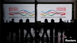 FILE - Travelers at Hong Kong International Airport after the lifting of COVID-19 movement controls in Hong Kong, China, Dec. 14, 2022.