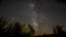 FILE - The Milky Way is seen during the Perseids meteor shower in Berducedo, Spain, Aug. 12, 2018.