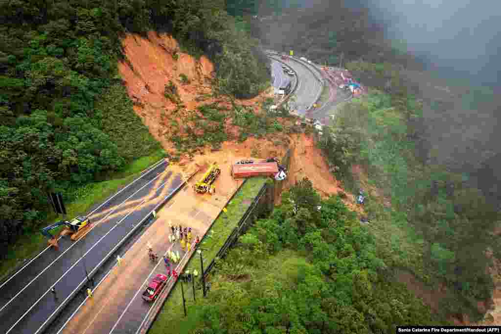 The BR-367 highway is seen blocked after a landslide in Guaratuba, Parana state, Brazil.&nbsp;Two people were found dead and at least 30 were missing in a landslide that swept away around 20 vehicles on a road in southern Brazil, firefighters estimated.&nbsp;
