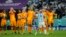 Argentina's Lionel Messi celebrates in front of Netherlands players after their World Cup soccer match at Lusail, Qatar, Dec. 9, 2022.