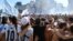 Fans celebrate their team's win at the World Cup, in central Buenos Aires, Argentina, Dec. 18, 2022.