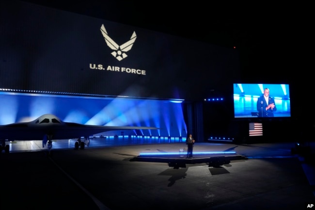 Secretary of Defense Lloyd Austin introduces the B-21 Raider stealth at Northrop Grumman Friday, Dec. 2, 2022, in Palmdale, Calif. The B-21 Raider is the first new American bomber aircraft in more than 30 years. Almost every aspect of the program is classified. (AP Photo/Marcio Jose Sanchez)