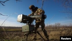 A Ukrainian serviceman sets up a Stugna-P anti-tank guided missile launcher in a frontline, in Donetsk region, Jan. 3, 2023. 