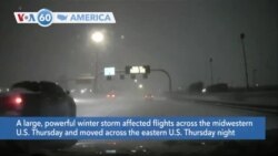 VOA60 America- Powerful winter storm causes flight cancellations, heavy snow, dangerous cold to much of the eastern U.S.